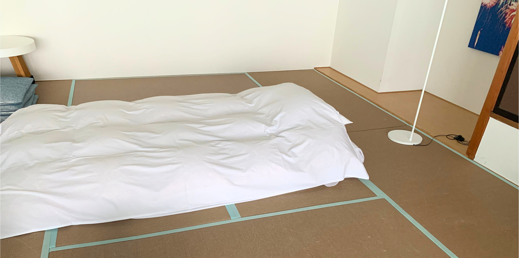 和室に敷かれた布団の画像